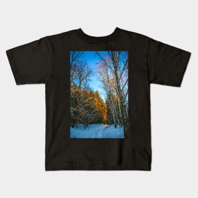 Winter landscape with snow-covered spruce forest. Kids T-Shirt by Olga Berlet